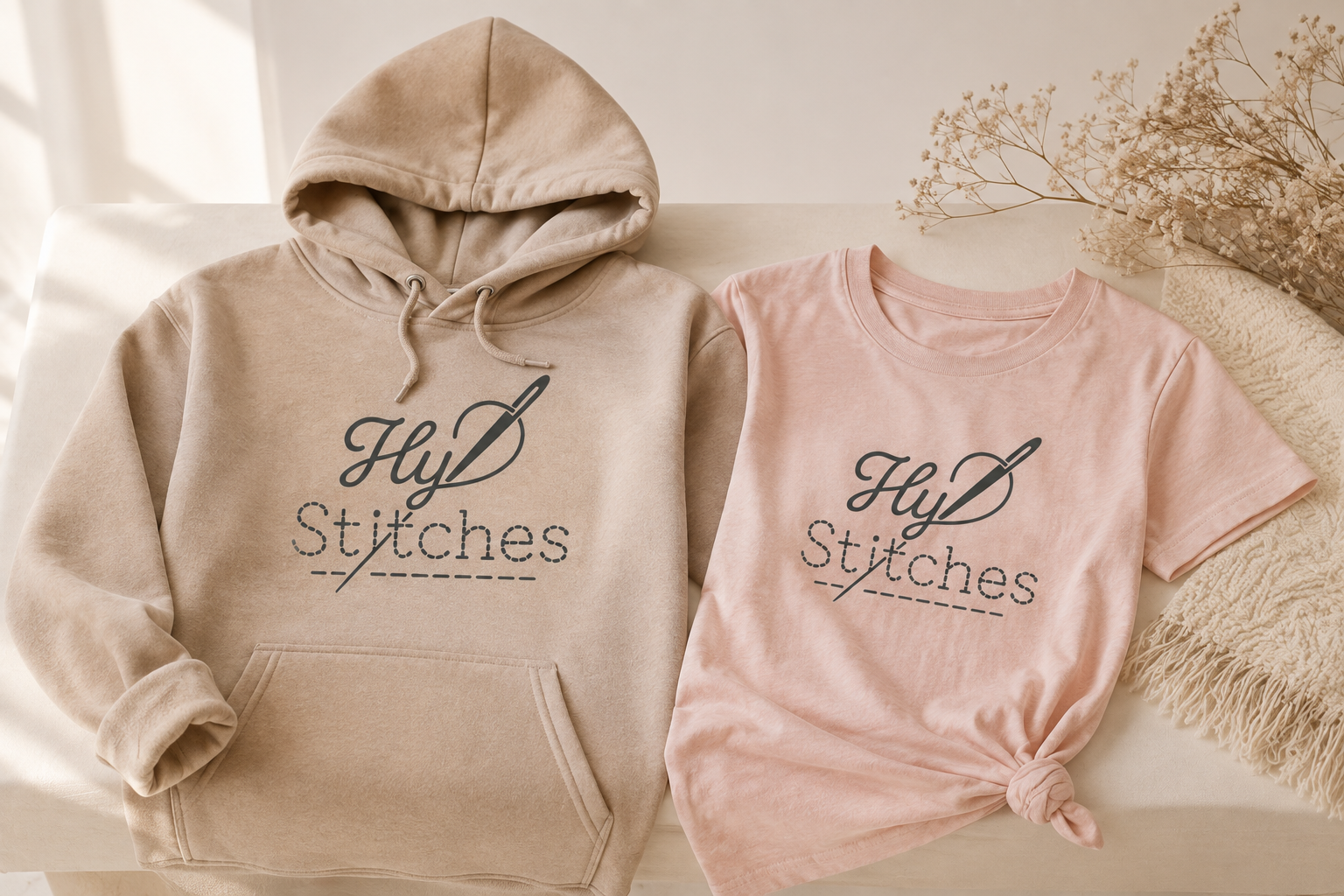 Taupe hoodie and blush T-shirt with the Hy Stitches master logo; concept mockup